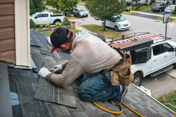 Professional Roofing technician working in Holtsville, NY